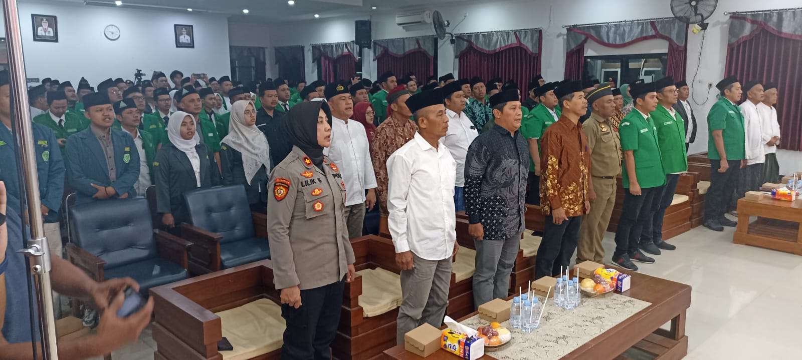 Foto: Kapolsek Manguharjo menghadiri inaugurasi pengurus GP Ansor Kota dan Kabupaten Madiun periode 2024–2028 di Gedung Bakorwil Kota Madiun.
